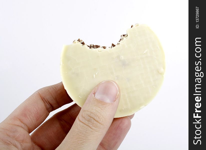 Closeup of white chocolate biscuit on a white plate