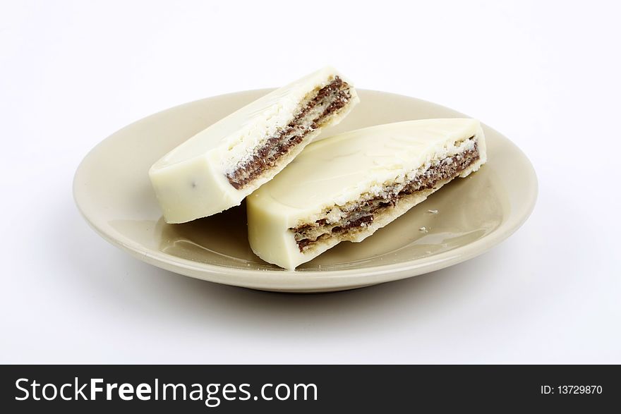 Closeup of white chocolate biscuit on a white plate