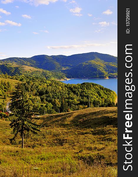 Autumn mountain scape and lake at sunset. Autumn mountain scape and lake at sunset