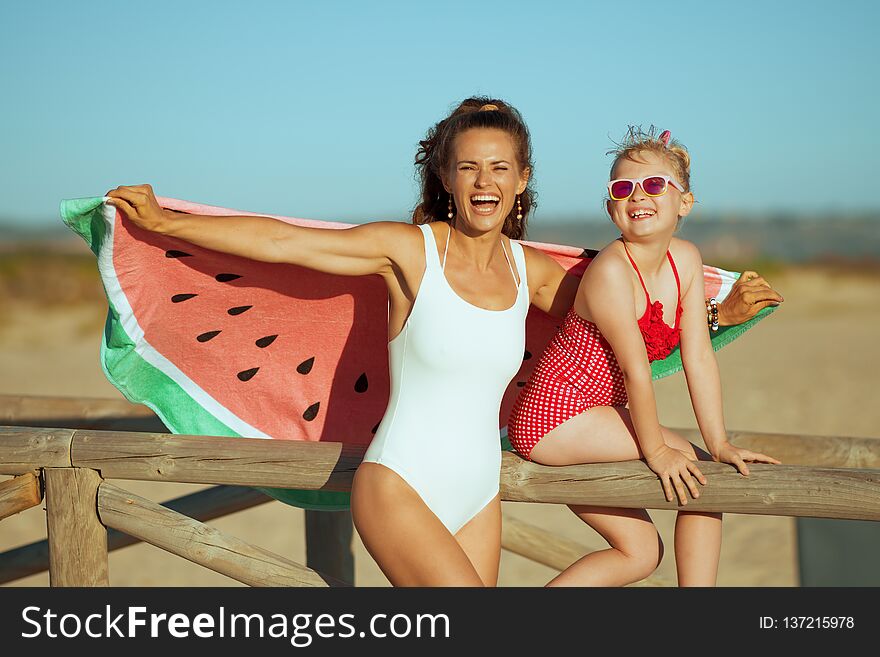 Mother and daughter holding funny watermelon towel