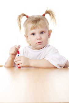 Child Playing With A Syringe Royalty Free Stock Photo