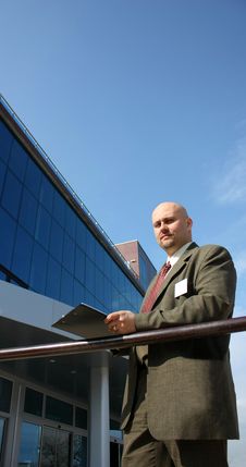 A Business Men In Front Of A Building Stock Photo