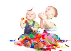Children Is Sitting On A Flow With Feathers Stock Photography Children Is Sitting On A Flow With Feathers Stock Photography