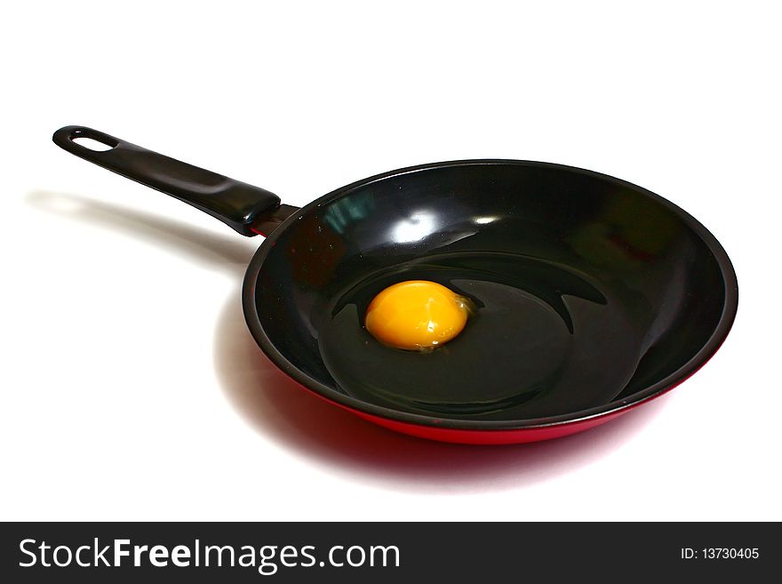 Raw Egg On A Frying Pan