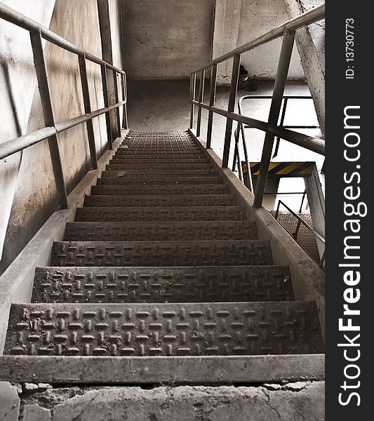A metal staircase at an abandoned factory. A metal staircase at an abandoned factory