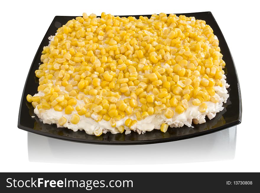 Salad with corn on a plate on a white background