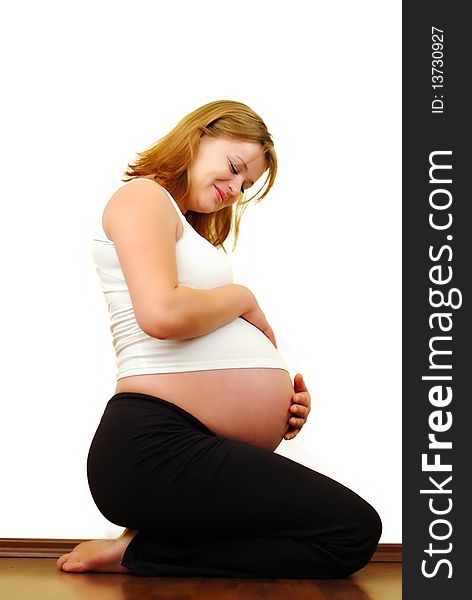 Pregnant woman against white background
