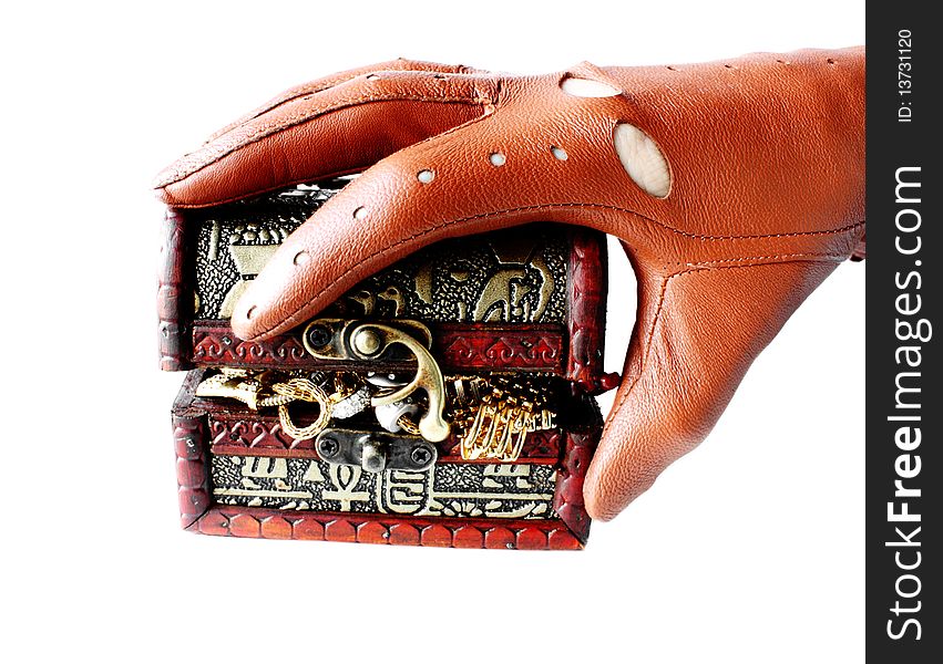 Hand in glove holding casket with jewelry