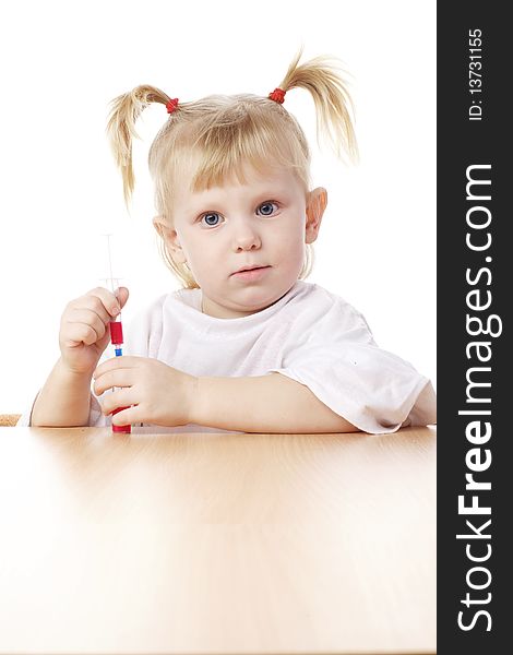 Child playing with a syringe