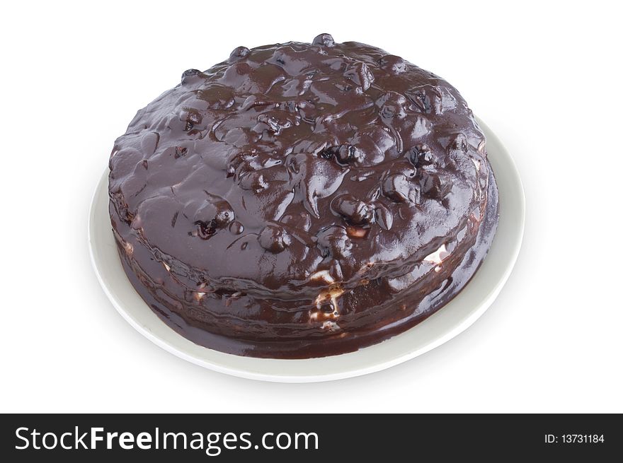 Chocolate cake on a plate on a white background