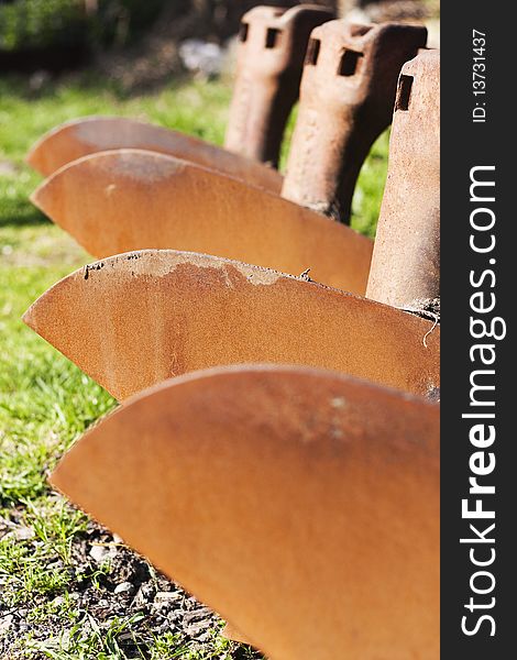 Vertical composition of rusted plough array