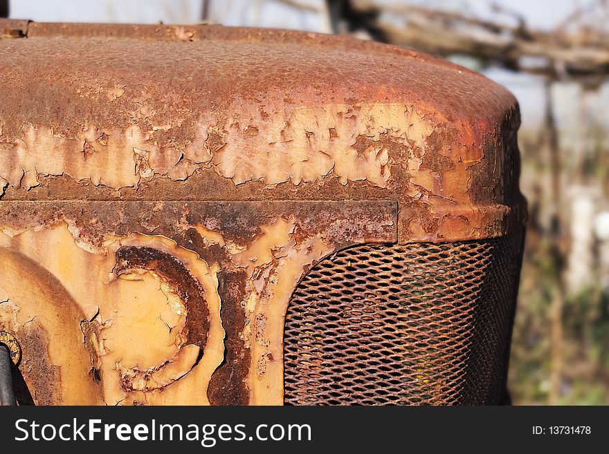 Rusted tractor hood with old paint. Rusted tractor hood with old paint