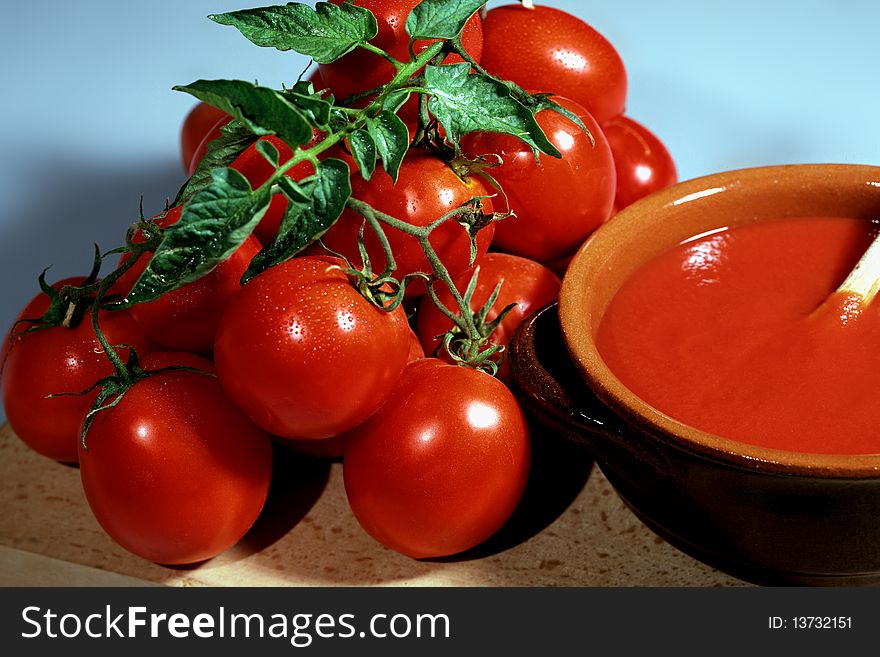Small bunch of red tomatoes with sauce. Small bunch of red tomatoes with sauce