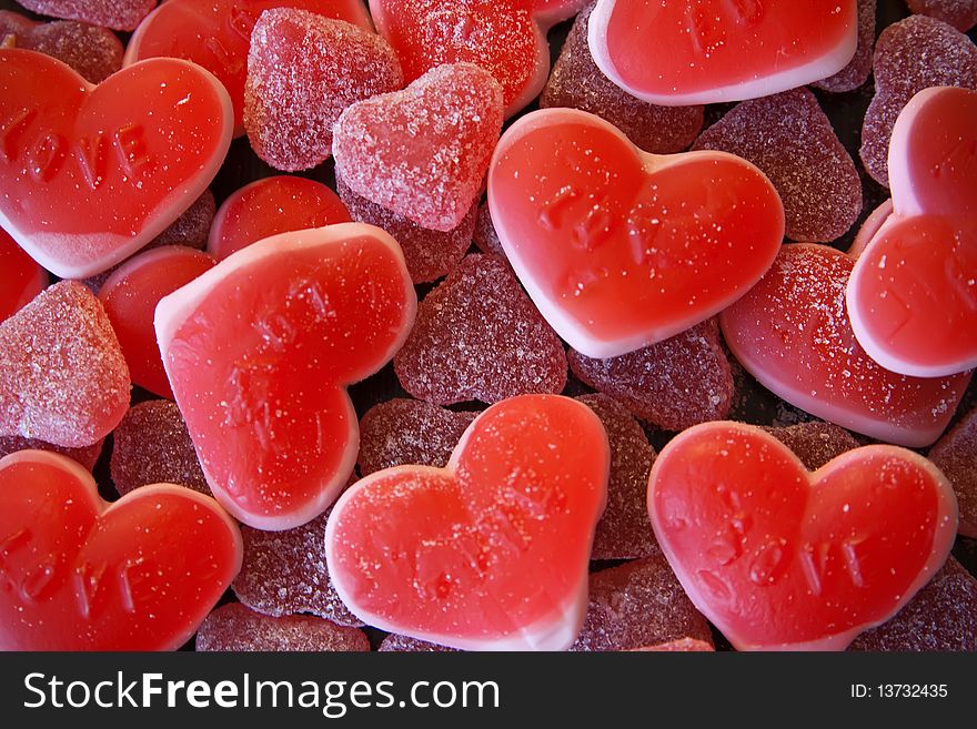 Close-up background made of red heart-shaped candies