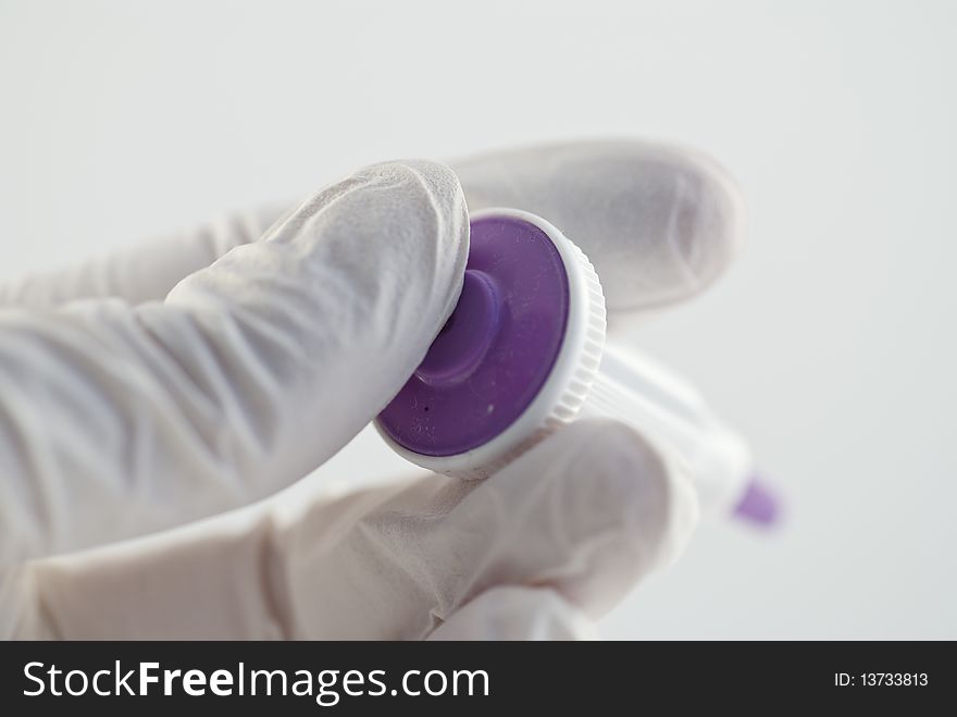 A capillary needle for blood samples in the finger. The purple colour means it is a size for adults.