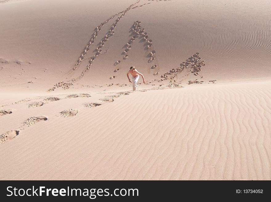 Playing in a sand dune