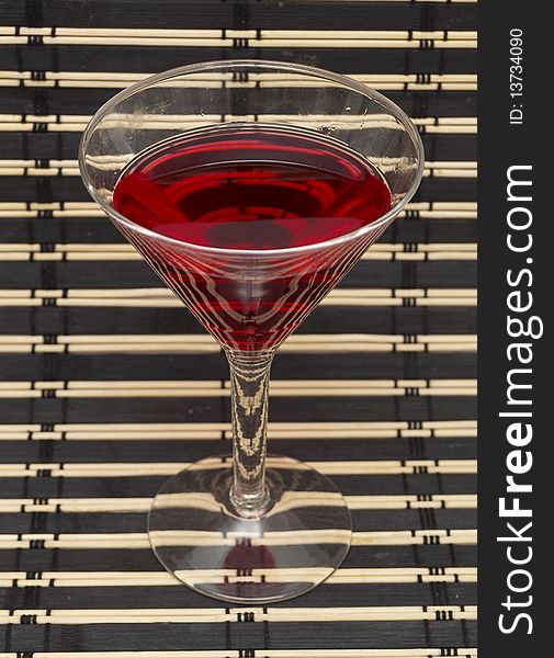 Martini glass with wine on a striped cloth