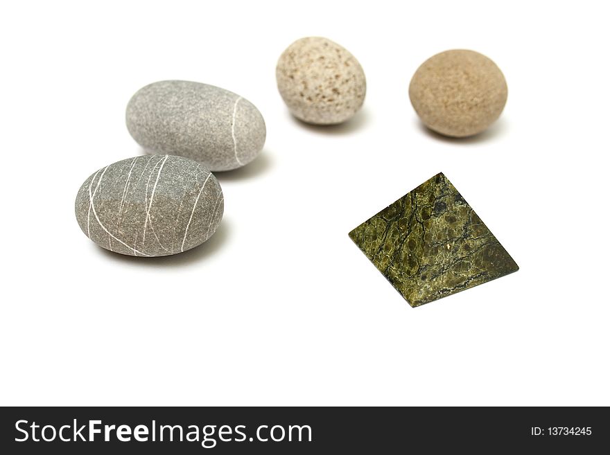 Round stones have gathered around of a pyramid. Round stones have gathered around of a pyramid.