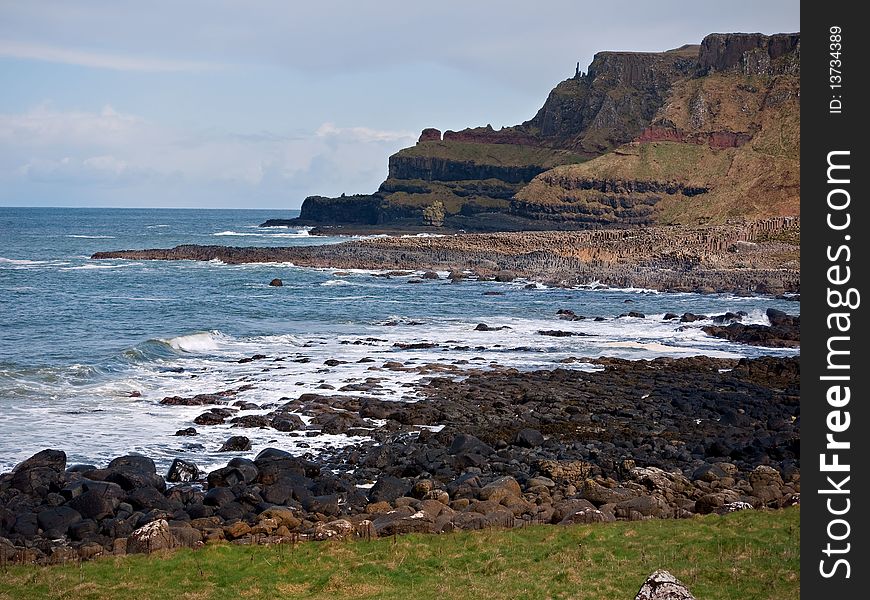 The main entrance to the Giant's Causeway stretching out from Ireland to Scotland