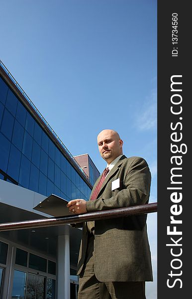 A Business Men In Front Of A Building