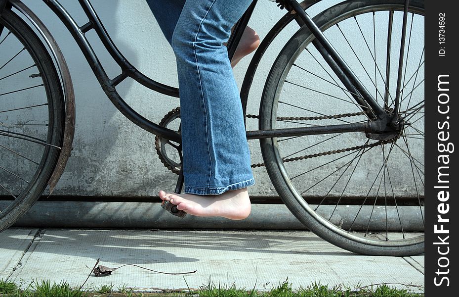 Young women on bicycle in action