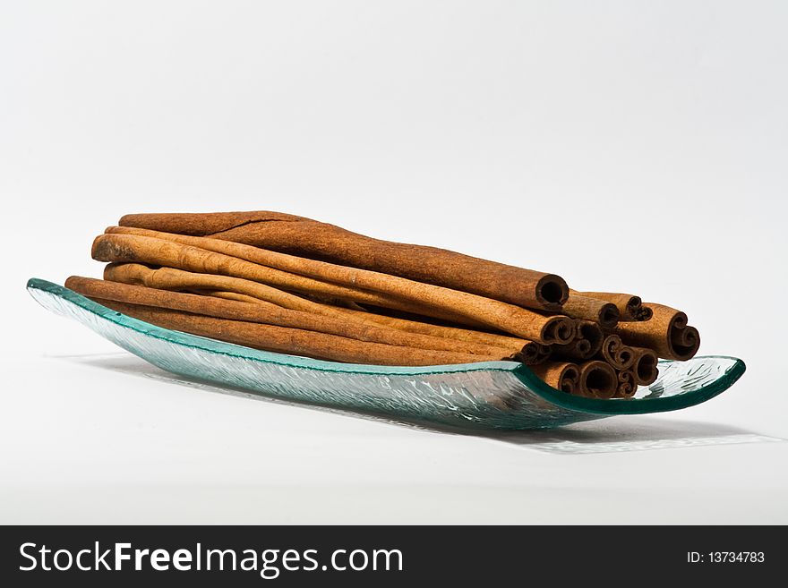 Cinnamon sticks in a glass dish