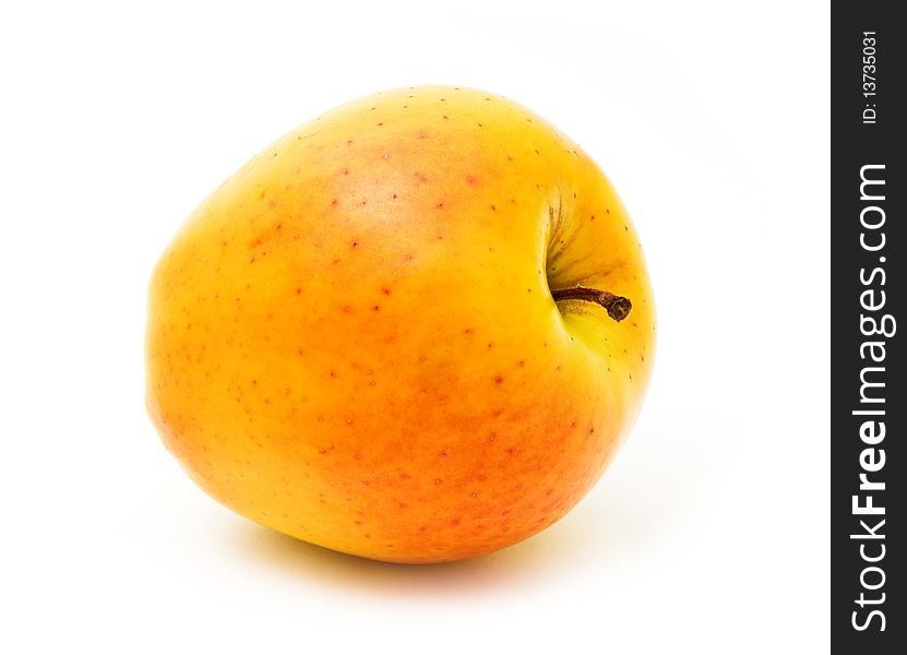 Ripe yellow apple, white background