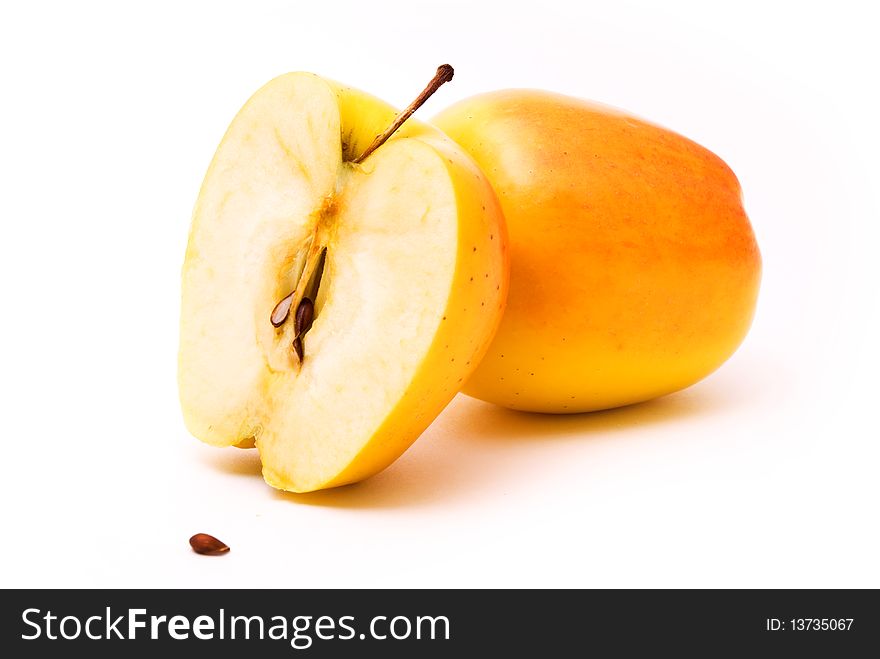 Ripe yellow apple, white background