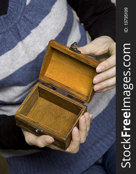 Hands Holding A Decorative Wooden Box