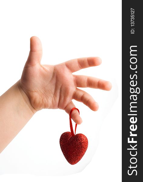 Red heart in the children's arm, white background