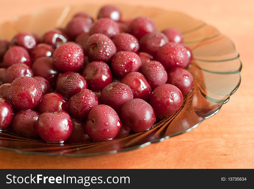 Cherry dish placed in dew. Cherry dish placed in dew