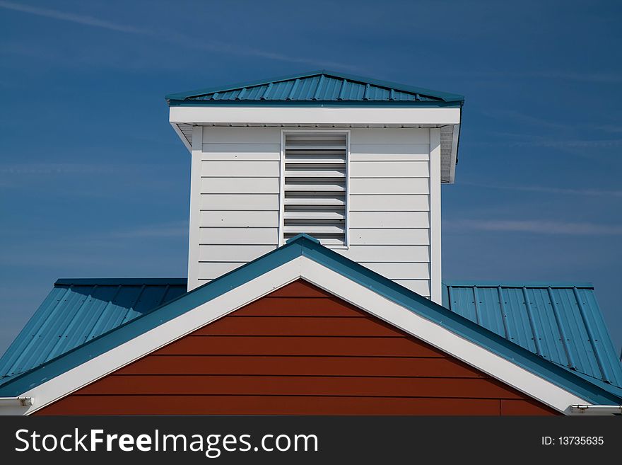 Cupola and roofline set against a blue sky at North Boundary Park in Cranberry Township, PA. Cupola and roofline set against a blue sky at North Boundary Park in Cranberry Township, PA.