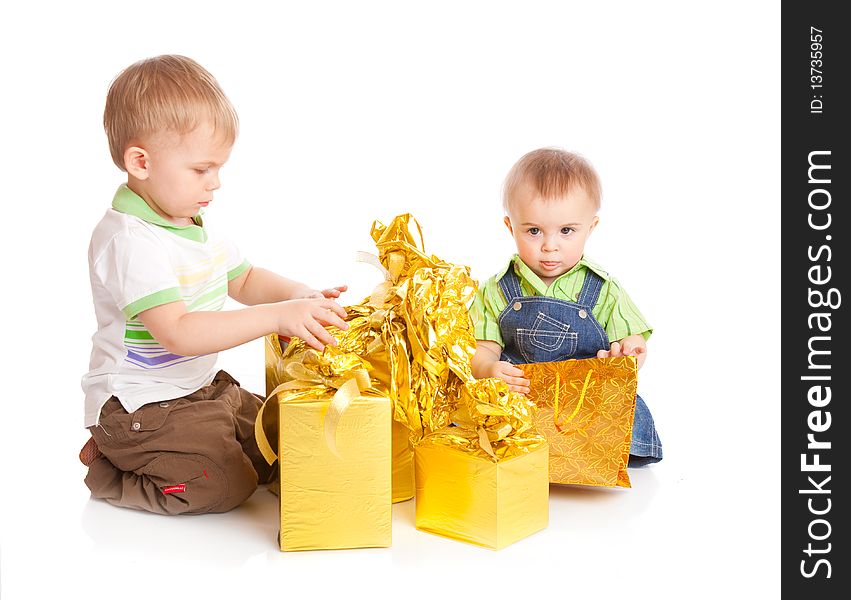 Two boys with gifts. Isolated on white background