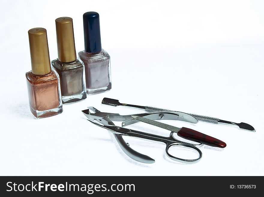 Varnishes, nippers, nail file and scissors for manicure. Varnishes, nippers, nail file and scissors for manicure