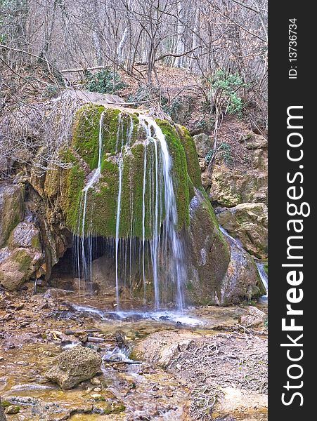 Full-flowing waterfall in forest