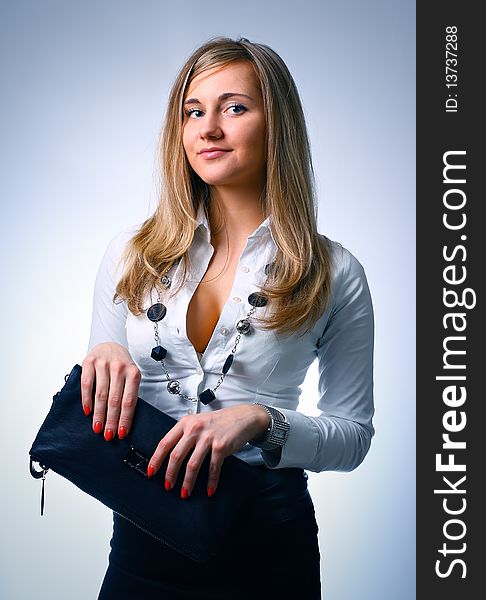Young business girl over a white background, studio shot