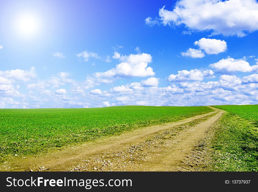 Green Field And Blue Sky Conceptual Image.