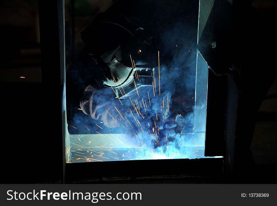 Man in action, worker weld metal. Man in action, worker weld metal