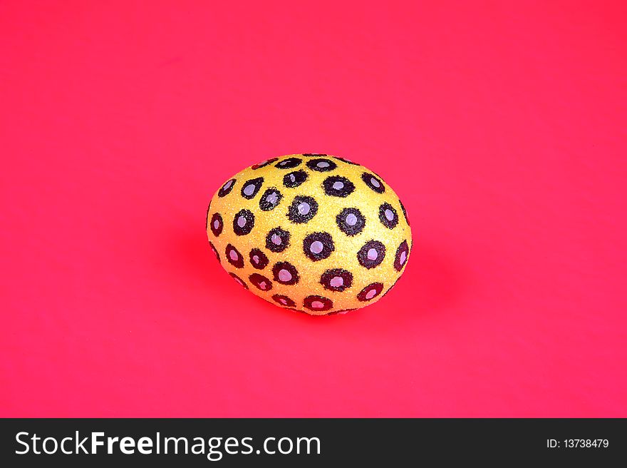 Painted egg on pink background