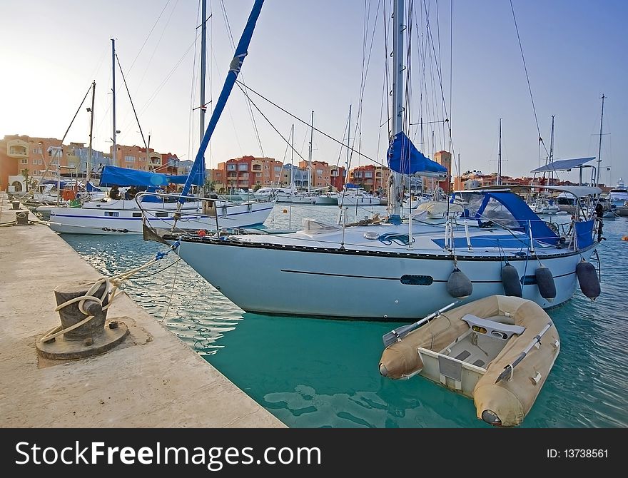 Sailing yachts moored in a private marina. Sailing yachts moored in a private marina