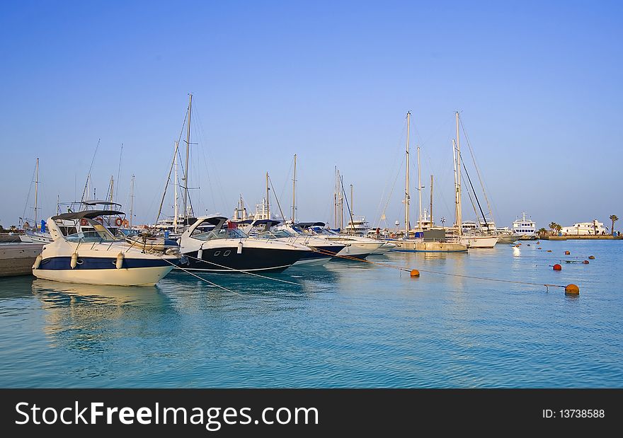 Motor boats moored in a private marina. Motor boats moored in a private marina