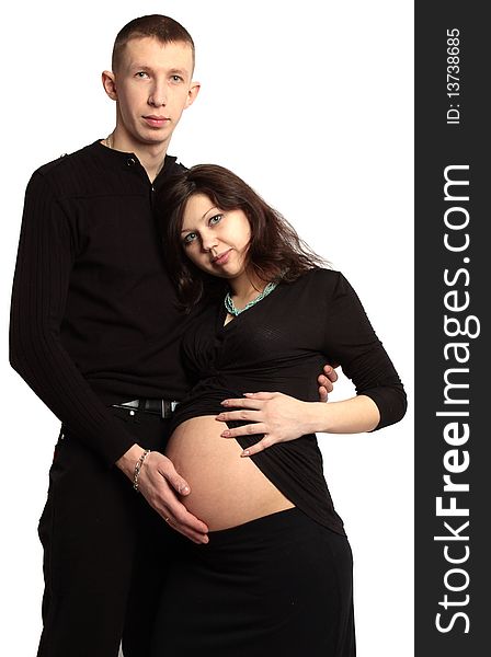 Affectionate man holding his pregnant woman's belly