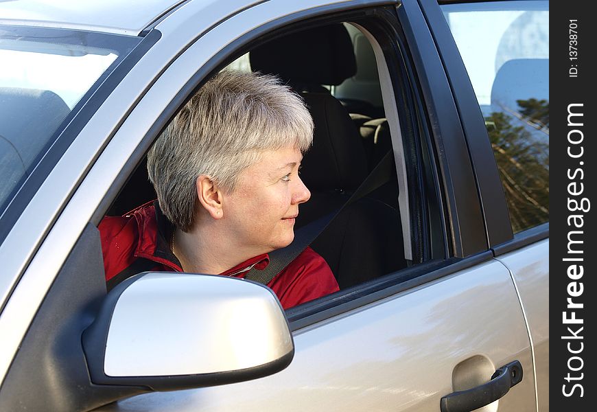 Middelage woman drivng in her car. Middelage woman drivng in her car