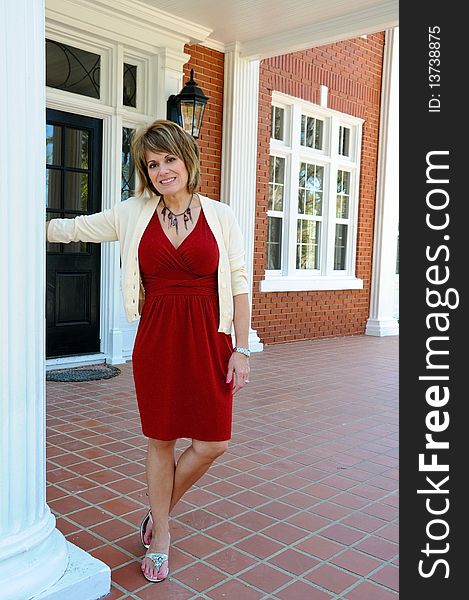 Attractive Woman on the Porch of a Southern Mansion. Attractive Woman on the Porch of a Southern Mansion