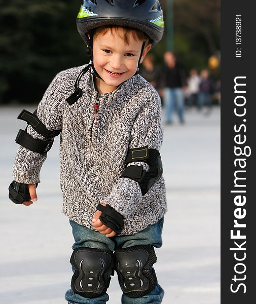 Smiling boy in roller blades outdoor