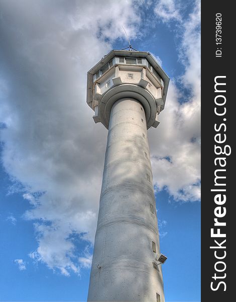 Viewing a massiv build watchtower with antenna on top. Viewpoint is very close at the tower. The weather is cloudy. Its an hdr photo. Viewing a massiv build watchtower with antenna on top. Viewpoint is very close at the tower. The weather is cloudy. Its an hdr photo.