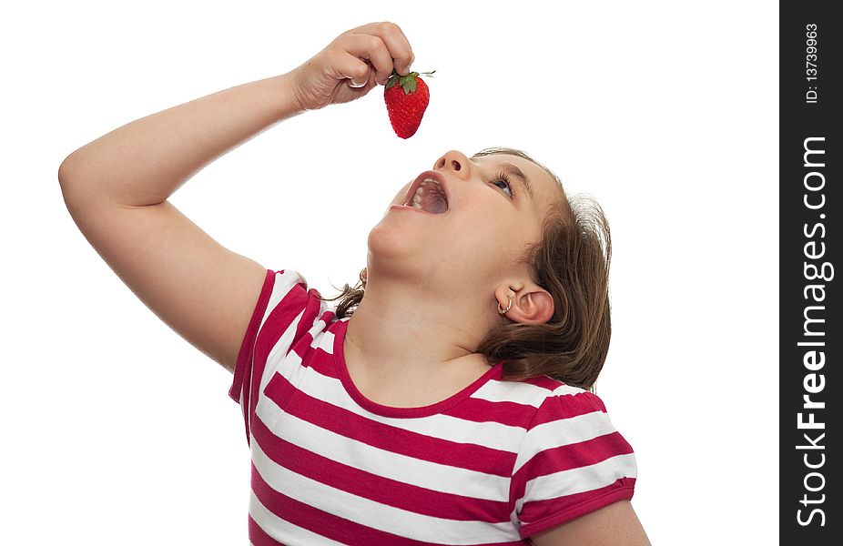 Beautiful girl about to eat a strawberry