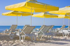 Chairs And Umbrellas On The Beach Royalty Free Stock Images
