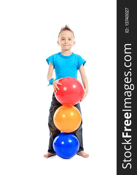 Portrait of a cute sporty boy standing with balls. Isolated over white background. Portrait of a cute sporty boy standing with balls. Isolated over white background.