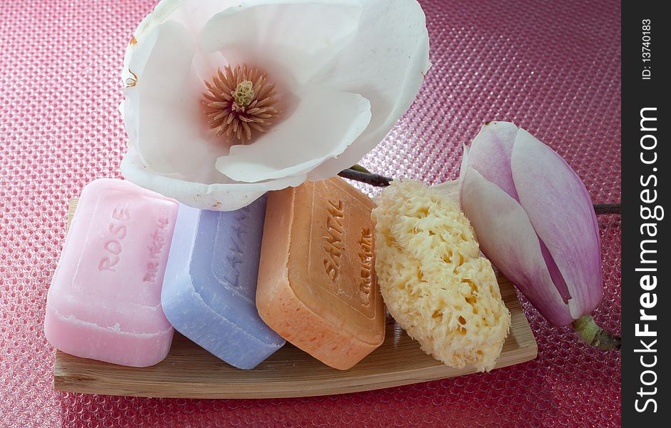 Soaps, and sponges with magnolia flower. Soaps, and sponges with magnolia flower